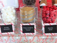 there are candy and candies in glass bowls on the table, along with other treats