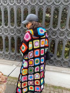 "* This cozy cardigan is perfect for a cool fall and winter days wardrobe.  * Made by hand using a beautiful patchwork of granny squares. The design can be customized to match any style with its many color options, or made in solid colors for easy layering.  * Our model in the picture is 172 cm high with 60 kg and wearing an M size.  * Note that everything at Smyrna Collective is handmade individually by our creators. So we can do any customization (size, color, design), any personalization that Crochet Cardigan Patchwork, Black Granny Square, Knit Gifts, Granny Square Cardigan, Square Cardigan, Patchwork Cardigan, Boho Cardigan, Cardigan Crochet, Custom Made Clothing