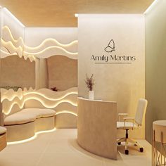 the interior of an upscale spa with white walls and lights on the ceiling, along with chairs and desks