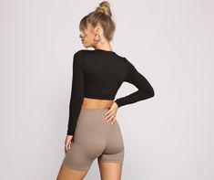 This crop top brings all the hype for your outfit. The crop top features a round neckline. fitted long sleeves. and a cropped hem. Complete your look with high waist biker shorts and chunky sneakers.Fit & Features Round neckline Fitted long sleeves Cropped hem Smooth knit fabric Form hugging fit Model is 5'9" with a 32" bust. 24" waist and 34" hips. She is wearing a size small.