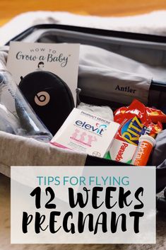 an open suitcase with the words tips for flying in pregancy written on it