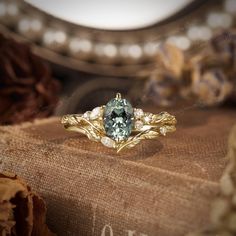 a close up of a ring on top of a book