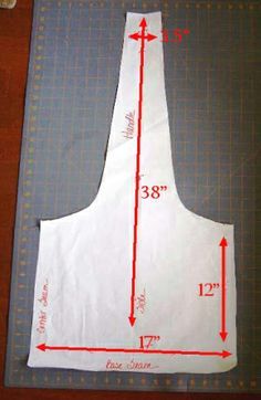 an apron is shown on a cutting board with the measurements for it to be cut