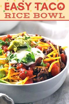 this easy taco rice bowl is loaded with ground beef, cheese and avocado