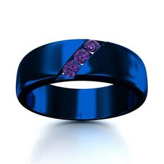 a blue ring with purple stones in the center