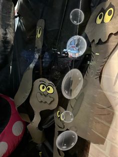 an image of a car window that is decorated with cartoon characters