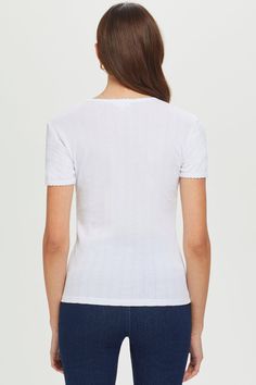 Perfectly on point: a classic crew-neck tee dressed up with a pretty pointelle knit and scalloped trim. 100% Peruvian cotton One-of-a-kind pointelle knit with scalloped trim for an elegant, feminine look Made in Peru Body length: 22 ½” Machine wash Elegant Feminine, Pointelle Knit, Scalloped Trim, Everyday Luxuries, Feminine Look, Tee Dress, Crew Neck Tee, Peru, White And Black