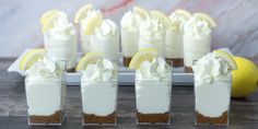 small desserts with lemon slices and whipped cream