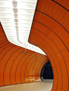 an orange subway tunnel with no people inside