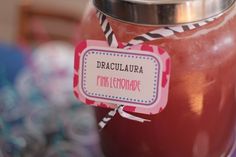 a jar filled with liquid sitting on top of a table