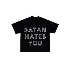 Satan hates you t shirt in black with grey reflective vinyl lettering. Model in picture is 6' and wear a size s.  Note: the shirt on the model is extra cropped. Black Edgy Cropped T-shirt For Streetwear, Edgy Black Cropped T-shirt For Streetwear, Black Cropped T-shirt With Text Print For Streetwear, Black Cropped T-shirt With Slogan For Streetwear, Black Cropped T-shirt With Graphic Print For Streetwear, Black Letter Print Relaxed Fit Cropped T-shirt, Black Relaxed Fit Cropped T-shirt With Letter Print, Black Letter Print Cropped T-shirt For Streetwear, Black Cropped T-shirt With Letter Print For Streetwear