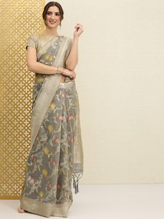 Grey and gold-toned sareeFloral woven design saree with zari and tasselled borderHas zari detailThe model is wearing the stitched blouse that comes with the saree Zari Saree, Saree Floral, Design Saree, Woven Design, Grey And Gold, Body Measurements, Custom Made, Gold Tones, Saree