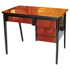 an orange and black desk with two drawers