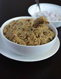 two bowls filled with oatmeal sitting on top of a table