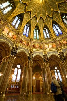 the inside of an ornate building with high ceilings