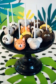 there are many cake pops with animals on them