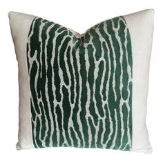 a green and white pillow with zebra print