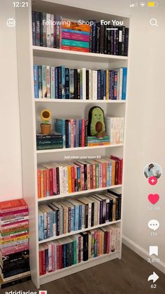 a white book shelf filled with lots of books