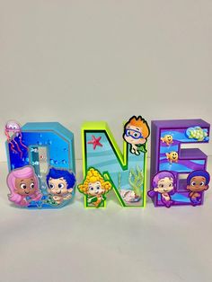 the letters are made up of cartoon characters