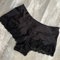 In New Excellent Condition. Beautiful Short Sleep Shorts They Have Lace Trimmed Around The Legs. But In Closure At The Side And Elastic At The Back. The Shorts Have A Silk Like Look To The Material Which Is 100% Polyester. They Are Completely Unlined In Lightweight. Waist Flat Across Is 15 Inches With Stretch To Almost 17 Inches. No Gusset. Beautiful For Lounging In Or Adding To A Cami As A Sleep Set Black Bottoms With Lace Trim For Night Out, Black Stretch Sleepwear With Lace Trim, Fitted Black Short Sleepwear, Black Lounge Bottoms With Lace Trim, Black Stretch Shorts With Lace Trim, Black Short Bottoms With Lace Trim, Black Lace Trim Short Bottoms, Black Stretch Short Sleepwear, Fitted Black Pajama Shorts