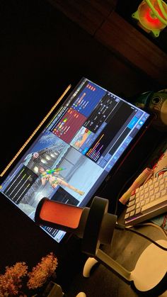 a computer monitor sitting on top of a desk next to a keyboard and mouse pad