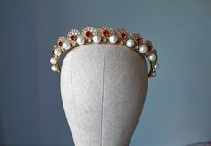 Wedding pearl tiara, Red crystal bridal crown ~MATERIALS~ -Austrian red glass crystals -Czech glass pearl -Gold filigree ~SIZE~ Height  1 inch (2,5 см) ~SHIPPING AND DELIVERY TIME~ This headpiece is ready to ship by 3-5 days The approximate time of shipment: - 10-16 days to Europe - 15-35 days to United States and other countries. ~IMPORTANT INFORMATION~ -Please allow as much time for shipping as possible before your important date ! I can't guarantee shipping time as its beyond my control.  -Ru Targaryen Jewelry, Red Tiara, Tiara Gold, Pearl Crown, Pearl Headpiece, Pearl Tiara, Gold Tiara, Crown Bridal, Bridal Crown