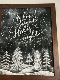 a chalkboard with the words silent night forest night written in white lettering on it