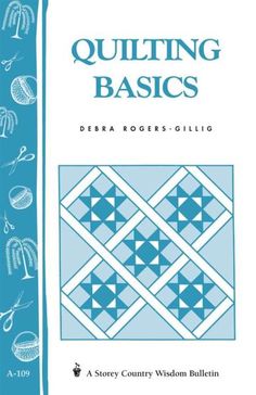 the cover of quilting basics book, with blue background and white trimmings