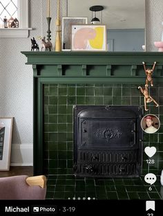 a living room with a fireplace and pictures on the mantle