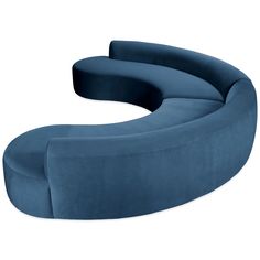 the curved couch is blue and sits in front of a white background