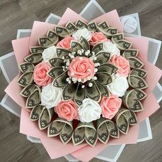 a bunch of money with pink and white flowers