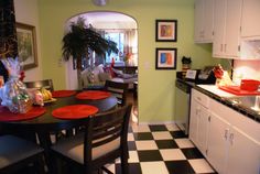 a kitchen with black and white checkered flooring