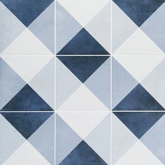 a blue and white tiled wall with squares