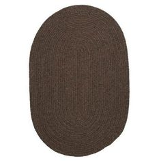 a brown oval rug on a white background