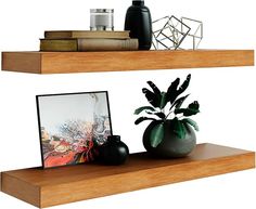 two wooden shelves with vases and pictures on them, one has a plant in it