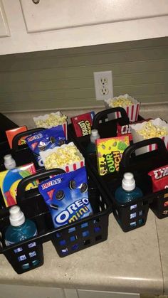 several containers filled with snacks on top of a counter