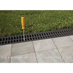 an image of a drain grate on the ground with grass in the background and text that reads use a screwdriver to unclip and remove grates