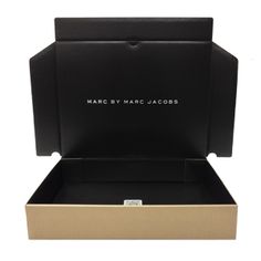 a black and gold box with the words marc by marc jacoss on it