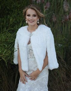 This Snow Fur Bridal Capelet is a lavish accessory for those brides looking to dress up an outfit. The delicate material of this capelet sits softly against the body and is incredibly soft to touch. The cape can be worn open, clipped together at the neckline with a Swarovski clip or clipped together all the way to keep you warm and cozy. Inspired by a design from the 1960s, this lightweight capelet's clean lines and open sleeves pair perfectly with a fitted or full gown. This white bridal capele Fur Capelet, Bridal Capes, Bridal Capelet, Full Gown, Silver Gown, Wedding Shrug, Dress Up Jeans, Jacket Cape, Bridal Cover Up