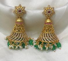 Premium Quality premium polish Antique matte finish Big Jhumka with precious bead hangings - MK Fashionkart - Fashion Jewelry Material: Premium quality premium polish with CZ stone and precious bead MK Fashionkart - Handmade Jewelry Indian Fashion Jewelry Suitable for Saree/Salwar/party wear dresses   SHIPPING : Ready to ship in 1 business day. This item will be shipped from The United States. Jewelry care instructions : 1. Please wipe the jewelry with a piece of cotton cloth after usage.  2. Store the jewelry in a cool, dry and air tight box or pouch.  3. Make sure the jewelry is away from direct heat and water. 4. Please wipe of any moisture, sweat, soap water after usage. Green Jhumkas For Reception And Festivals, Festive Green Danglers For Reception, Festive Green Fusion Style Jhumkas, Green Tilla Jhumkas For Reception, Fusion Style Jhumkas With Latkans For Reception, Fusion Jhumkas With Latkans For Reception, Indian Fashion Jewellery, Precious Beads, Jewelry Care Instructions