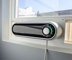 an electronic device is plugged into a window sill