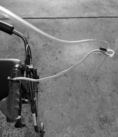 black and white photograph of the handlebars on a bicycle