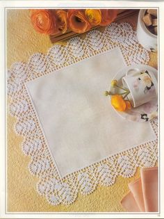 an image of a table with doily and flowers