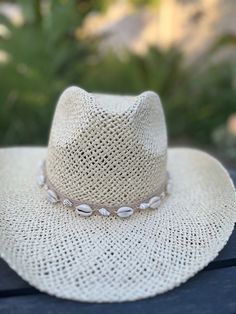 Western straw hat with shell embellished hat band .  Material : paper straw  One size fits most and is an average woman's hat size. Hat will fit up to 59cm head size . Hat features an adjustable straw string for a more custom fit  Soul Brim design and create quality hats for women.  At this time all SOUL BRIM hats are final sale. We take pride in our hats and want you to be satisfied with your purchase.  Please feel free to message us with any concerns and we will do our best to respond as quick Summer Wide-brim Straw Hat For Western-themed Events, Adjustable Southern Straw Hat For Western-themed Events, White Country Hat In Toquilla Straw, Western-themed Summer Straw Hat, Wide-brim Toquilla Straw Hat For Rodeo, Quality Hats