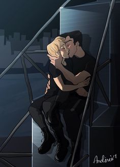 a man and woman hugging each other in front of a cityscape at night