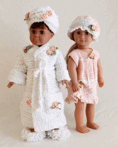 two dolls are standing next to each other