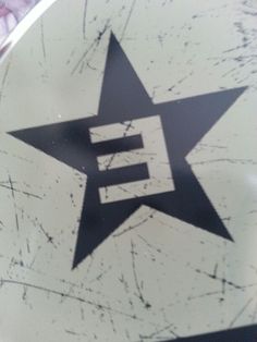 a black and white star with the letter e on it