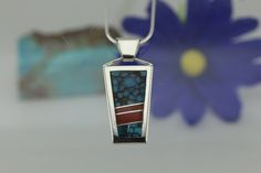 "This contemporary pendant is from our collection of Navajo Native American jewelry and handmade in sterling silver. It is an inlay style pendant with natural Turquoise and Coral Navajos are pioneers of silversmithing since the 1850's. Their jewelry is highly regarded because of its unique style and beauty. Traditionally, silver represents the main visual element and stones are considered accents for silver work. Contemporary designs enhance the stones and silver depending on the style, skill an Unique Sterling Silver Turquoise Inlay Necklace, Natural Turquoise Stone, Turquoise And Coral, Sky Design, Bird Pendant, Contemporary Pendant, Contemporary Designs, Silver Work, American Jewelry