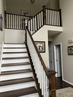 the stairs in this house are white and brown