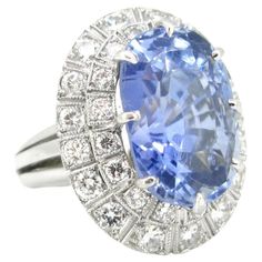 Weight: 17.62gr Metal: Platinum Stones: 1 Sapphire • Cut: Cushion • Carat: 20ct approximately • Origin: Ceylon No Heat Others: 32 Diamonds • Cut: Brilliant • Total Carat Weight: 2ct approximately • Colour: G/H • Clarity: VS Condition: Very Good Hallmarks: French – dog’s head Comments: This beautiful ring is set with a 20ct Ceylon No heat sapphire. The sapphire is surrounded with 32 brilliant cut diamonds for a total carat weight of 2ct approximately. There is a refined millegrain setting. The ri French Dog, Golden Ring, Big Rings, No Heat, Diamond Cluster Ring, Vintage Jewels, Beautiful Ring, Dream Jewelry, Diamond Cluster